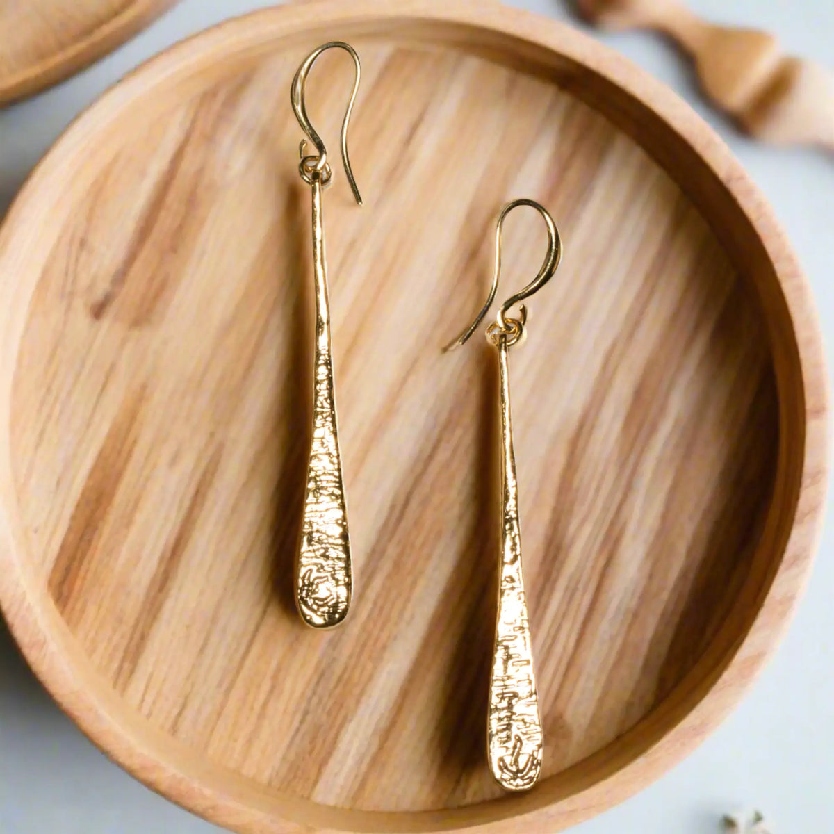 Gold-plated teardrop earrings by Suzie Blue Canada, elegant drop earrings with a sleek, polished finish in gold tone.