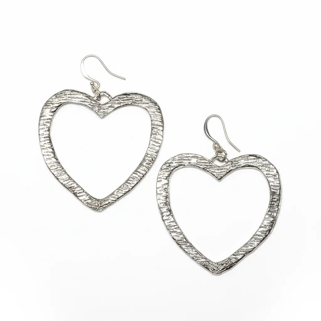 Silver plated textured heart earrings by Suzie Blue Canada, featuring a detailed heart design and shiny finish.