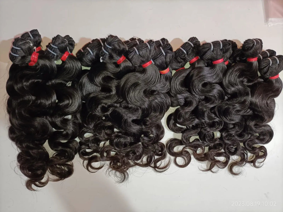 Indian Virgin Bodywave Hair Extensions bundle by Prithvi Mart, showcasing lush, wavy hair bundles with natural shine and texture.