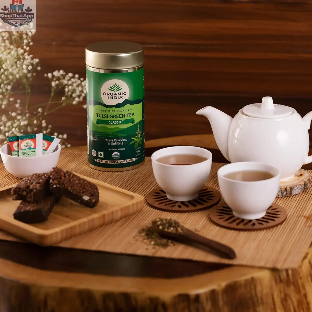 Organic India Tulsi Green Tea in a classic tin, featuring fresh, organic Tulsi leaves for wellness and herbal tea enjoyment.