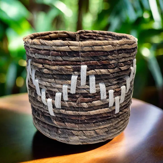 Banana leaf macrame planter basket by Suzie Blue Canada, eco-friendly zigzag design, ideal for home decor and plant display.