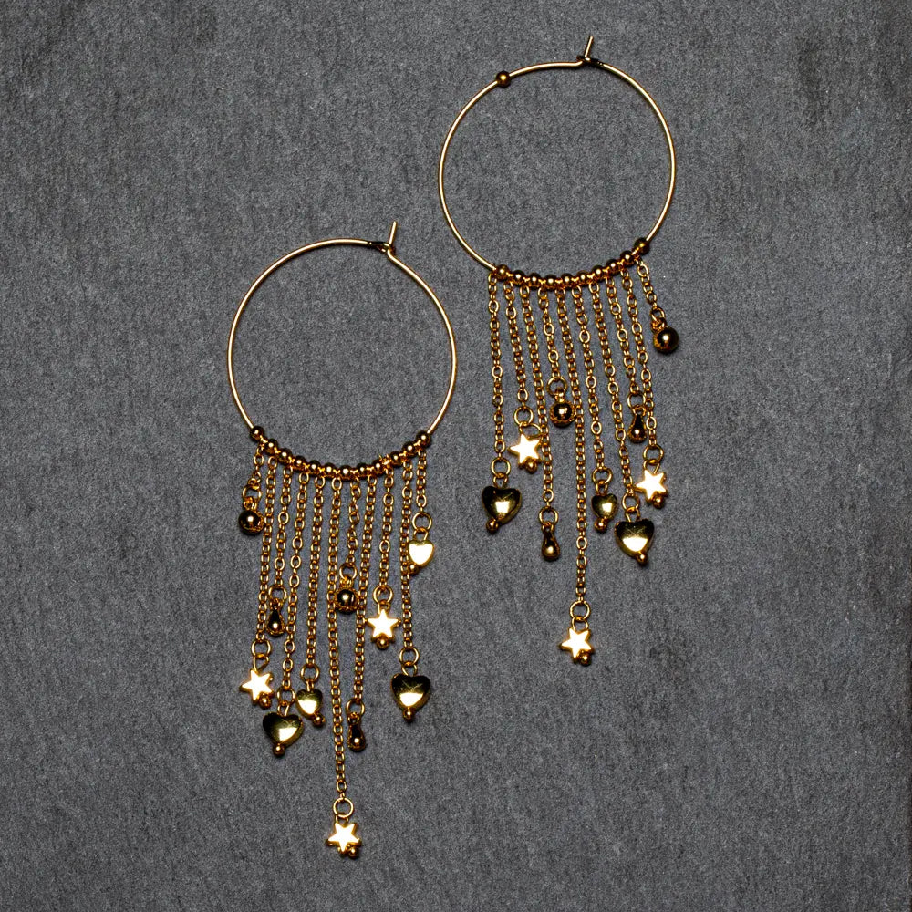 Gold plated ring and charms earrings by Suzie Blue Canada featuring elegant jewelry design on a white background.