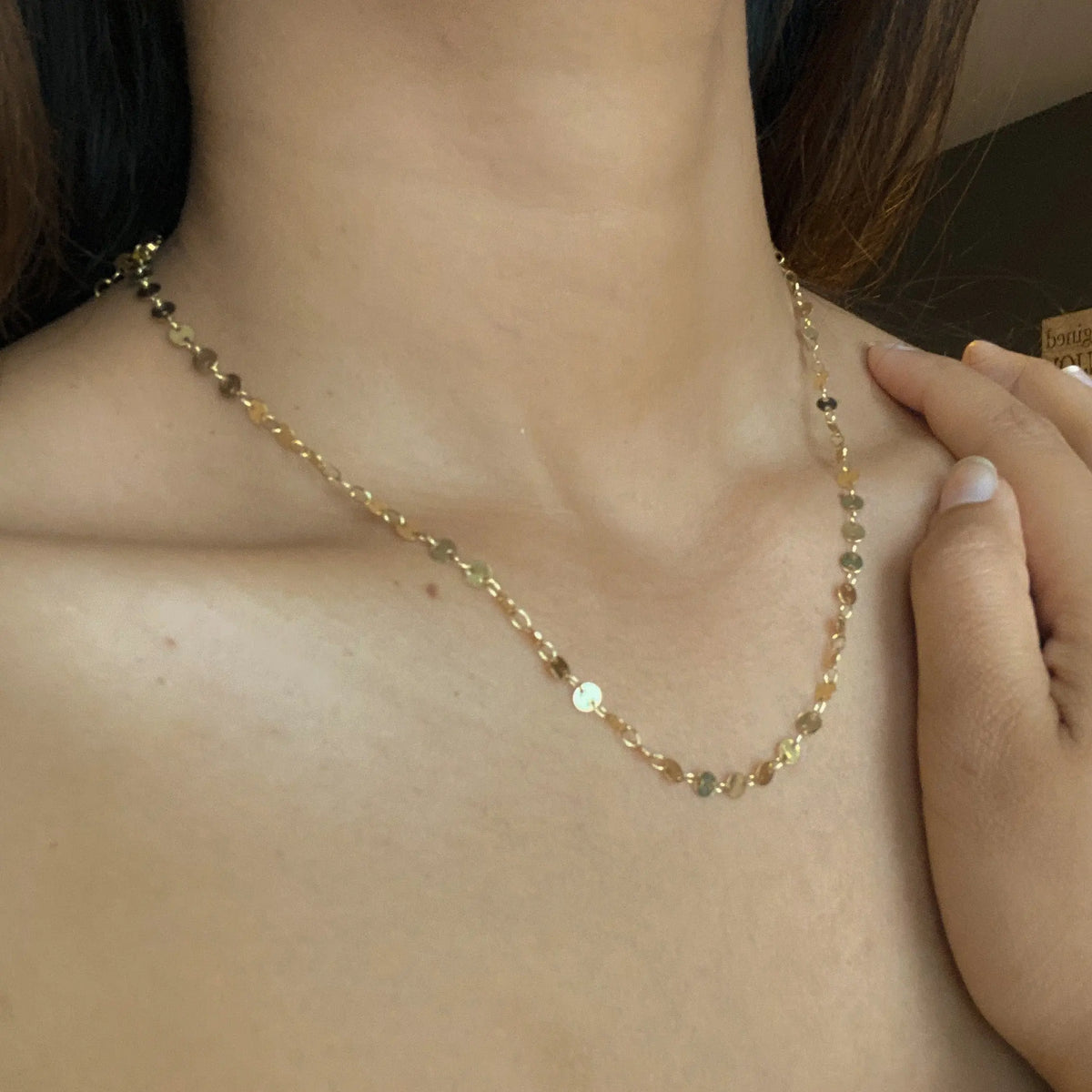 Gold plated disc chain necklace by Suzie Blue Canada featuring a delicate chain and round disc pendants.
