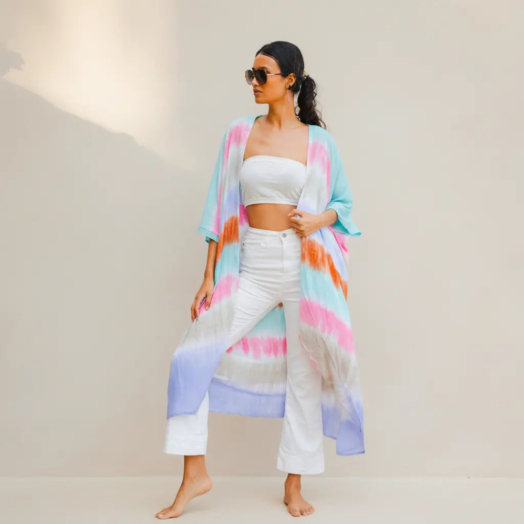 Colorful rainbow stripe kimono by Suzie Blue Canada, lightweight and stylish outerwear with vibrant pattern and flowing fit.