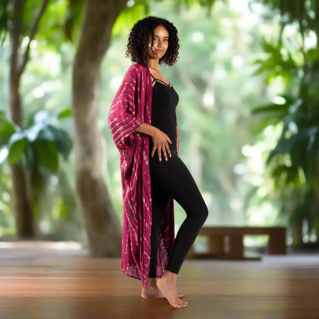 Tie-dye long kimono with bone motif from Suzie Blue Canada, featuring vibrant colors and flowing fabric design.