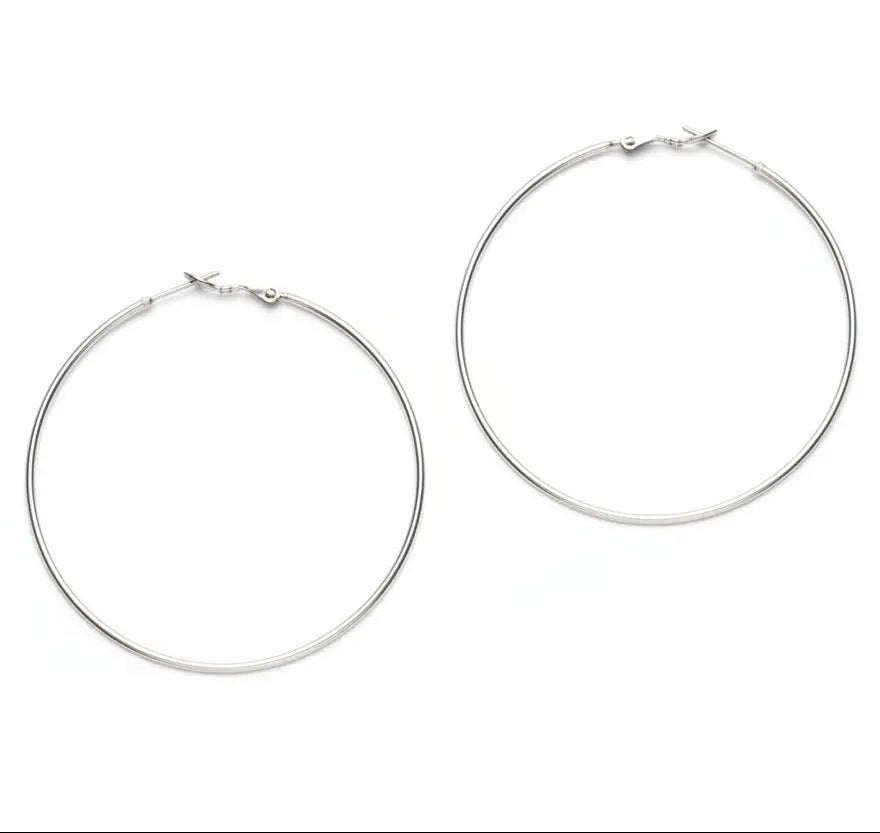 Large silver hoop earrings by Suzie Blue Canada, silver plated, with a smooth, shiny finish and classic circular design.