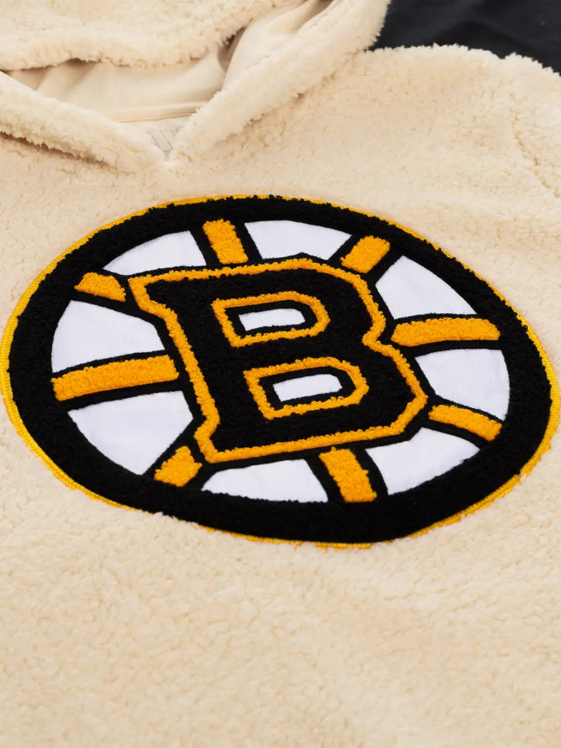 Boston Bruins ladies hoodie with cozy sherpa lining, featuring team logo and detailed stitching, by Calhoun Surf N' Skate.