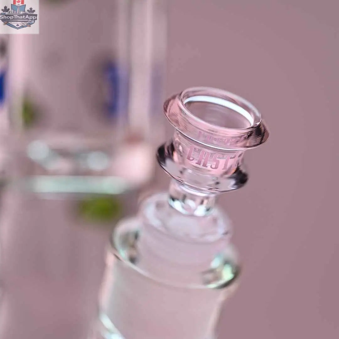 Close-up of Castle Glassworks 18-inch traditional beaker bong with a pink background and detailed bowl attachment.