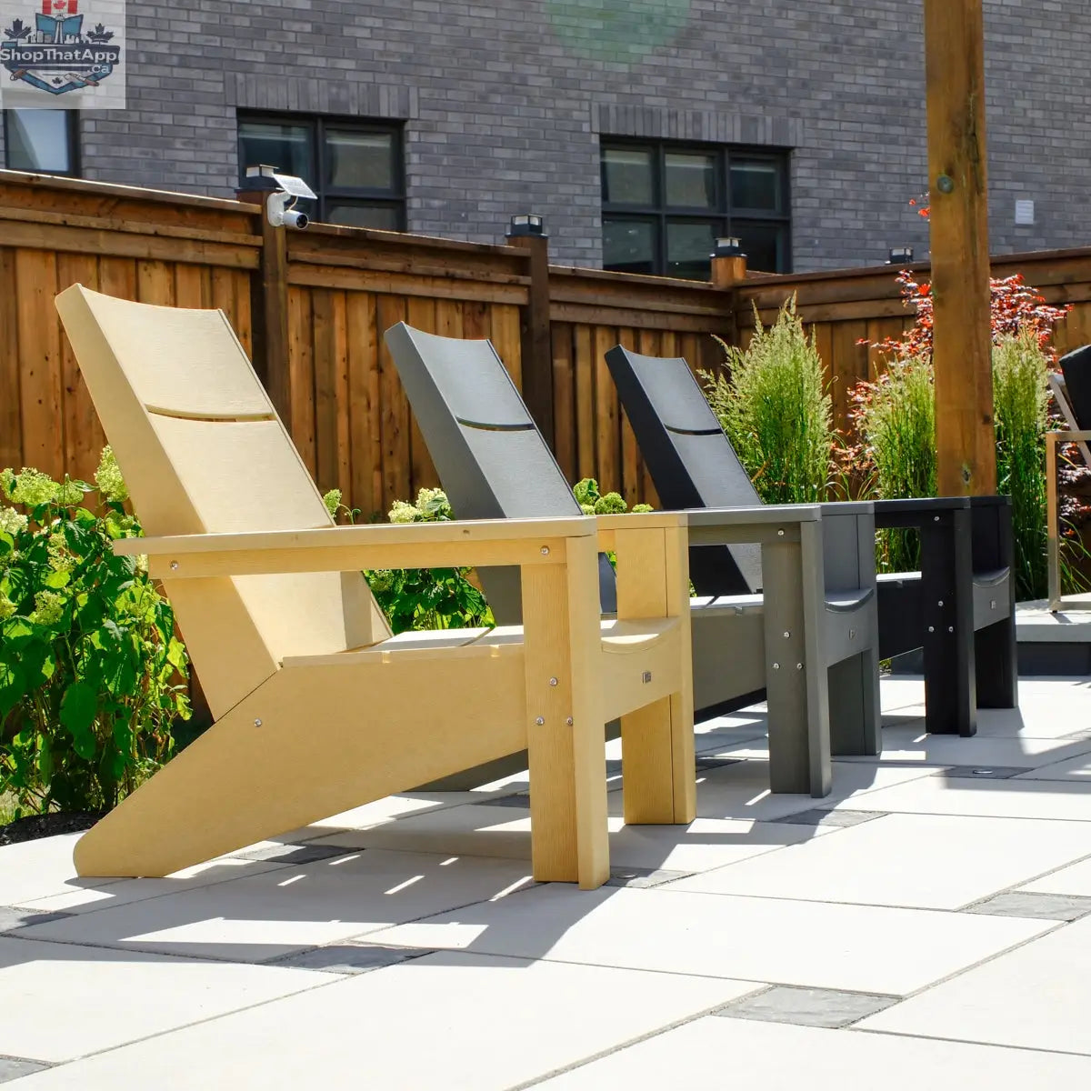 Enclover Acacia conversational set featuring modern Muskoka chairs with Sunbrella cushions for comfortable outdoor seating.