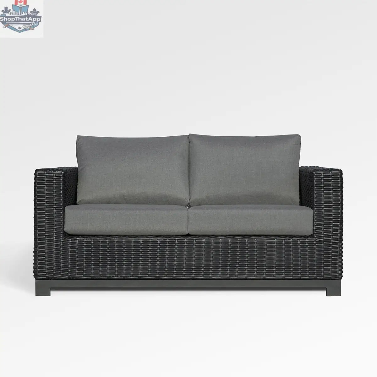 Enclover Trillium loveseat with Sunbrella cushions, stylish outdoor seating with a cozy, inviting design and vibrant fabric details.