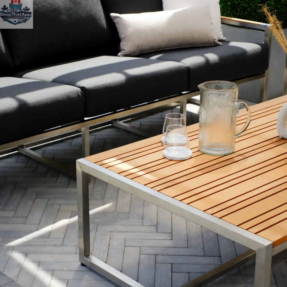 Enclover Acacia conversational sofa set with Sunbrella cushions, featuring comfortable outdoor seating and stylish design.