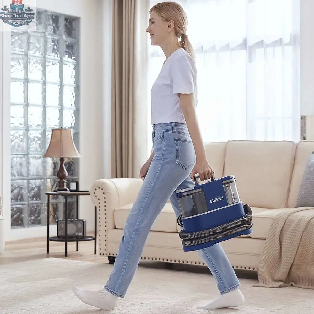 Home Essentials Outlet Eureka NEY100 portable carpet cleaner, compact household appliance with cleaning attachments and user-friendly design.