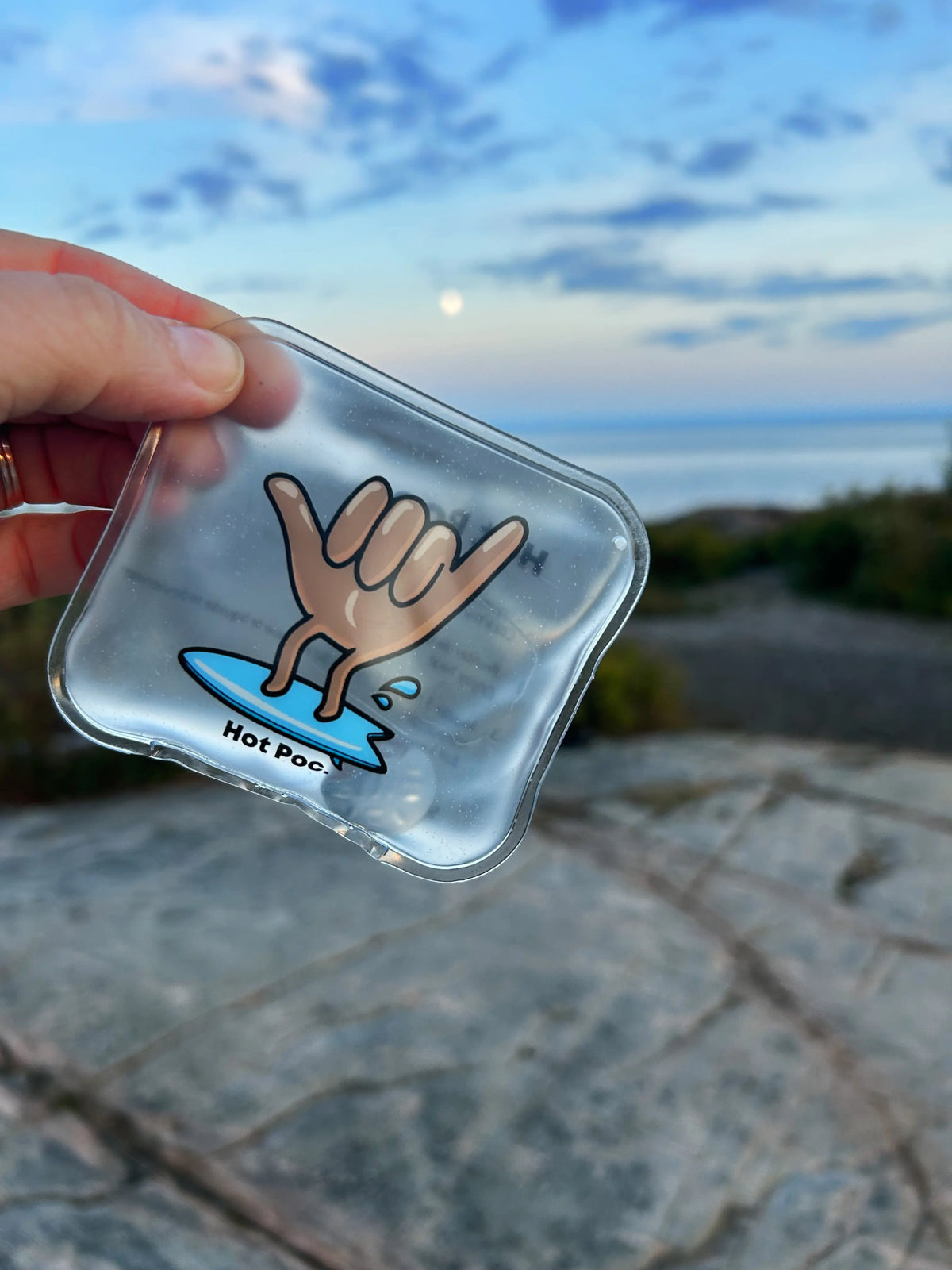 HotPoc Eco-Friendly Reusable Hand Warmers Family Pack with 12 warmers, shown in a baleine (whale) design on the packaging.