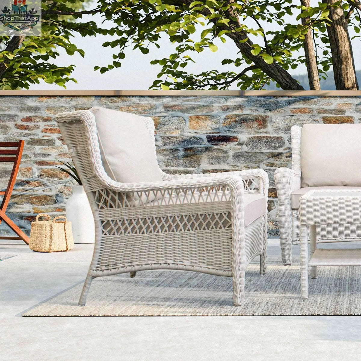 Krikacy Park Meadows white wicker outdoor club chair with plush cushions, ideal for stylish patio seating and outdoor relaxation.