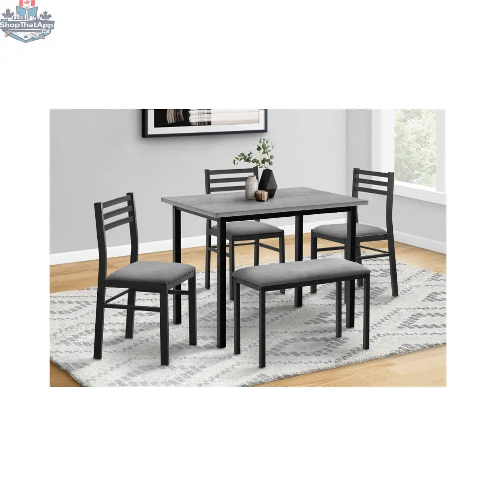 Black metal 5-piece dining room set with gray tabletops, featuring a table and matching chairs, by Monarch.