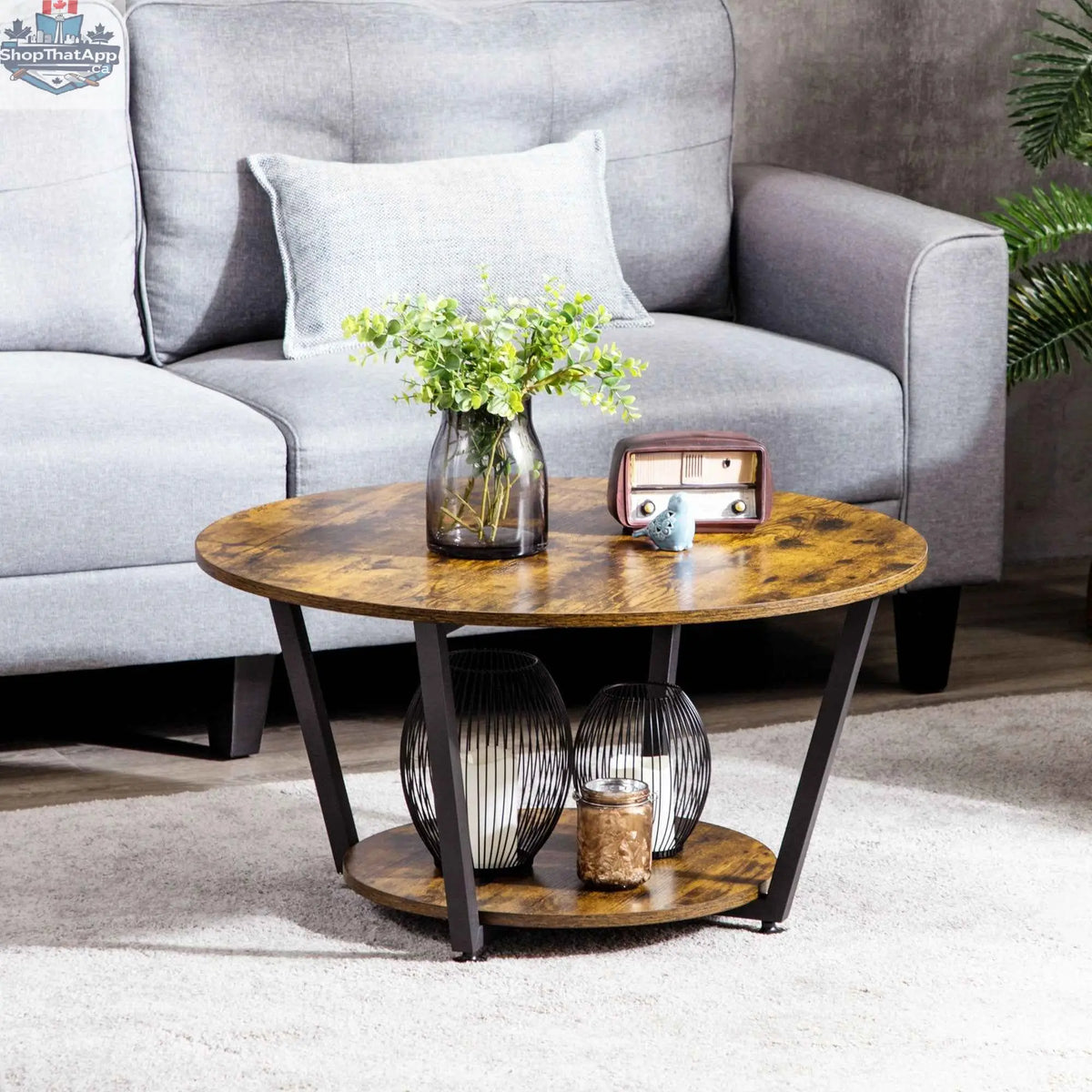 Rustic brown round coffee table with storage shelf from SLOTH Nation, showcasing a sturdy wooden design and practical storage space.
