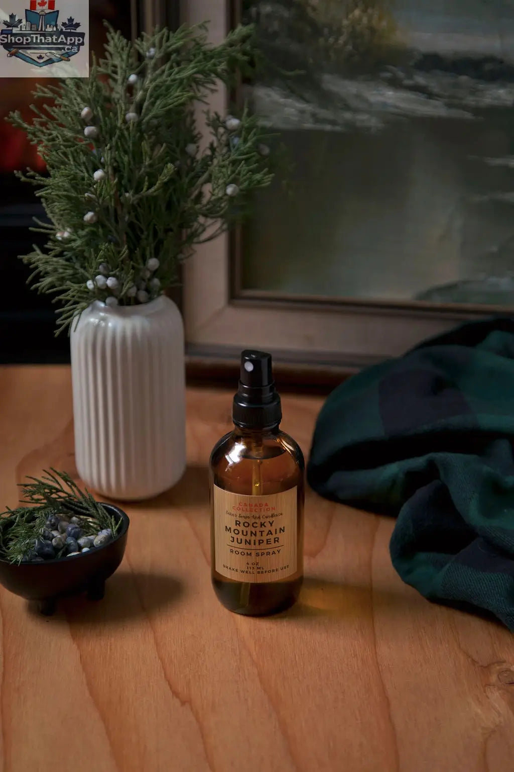 Rocky Mountain Juniper room spray by Stopandsmellthecandles, featuring a sleek bottle with juniper fragrance and natural botanical accents.