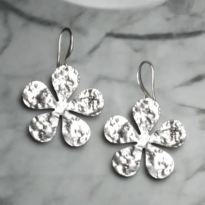 Hammered silver flower earrings with elegant silver plate design by Suzie Blue Canada, showcasing intricate floral details.