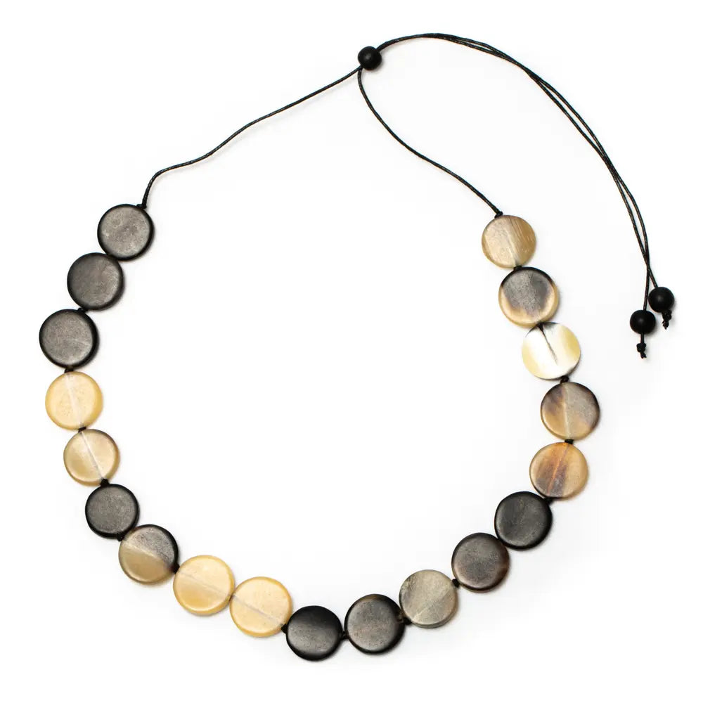 Simple Horn Disc Necklace by Suzie Blue Canada featuring a minimalist horn-shaped pendant on a delicate chain.