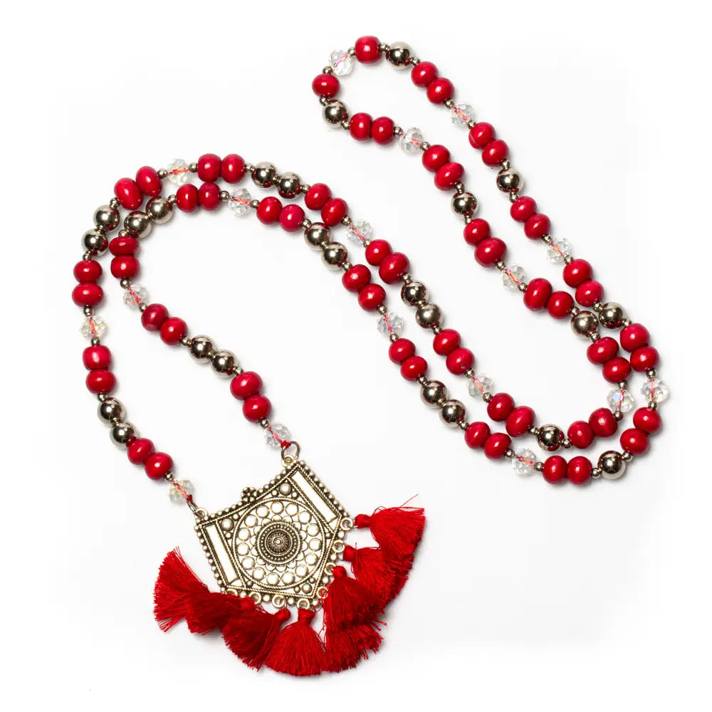 Wooden bead necklace with tassels and pendant by Suzie Blue Canada, featuring natural wooden beads and decorative tassels.
