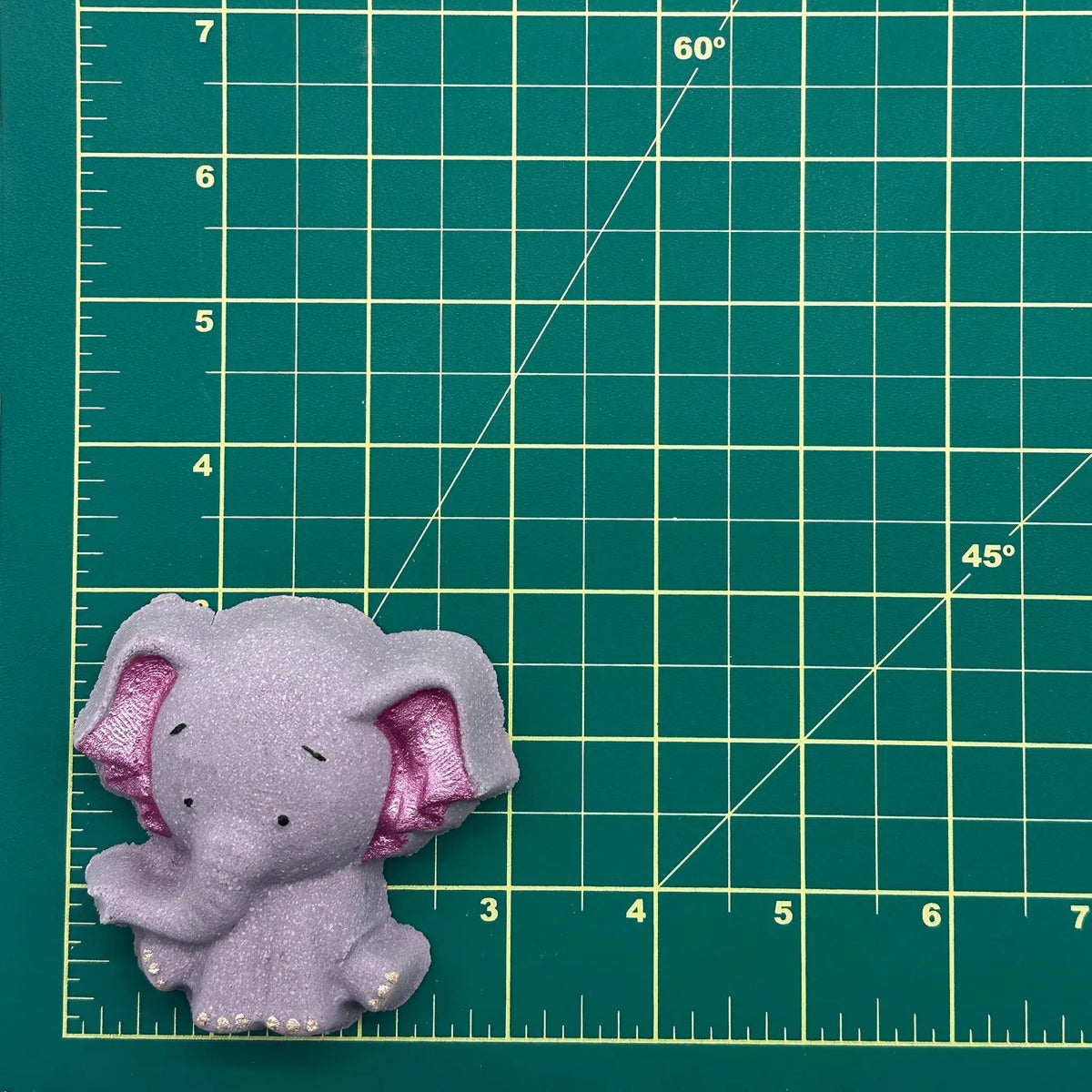 Mini elephant figurine from The Bomb Bar Canada, a charming home décor accent with an adorable animal design.