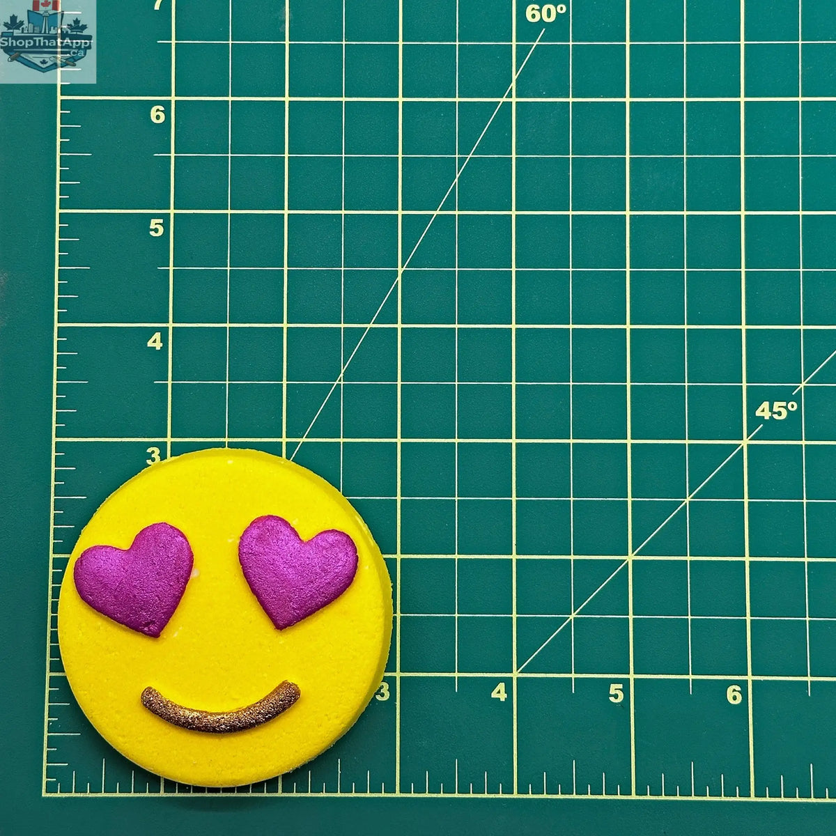 Mini Heart Eyes Emoji bath bomb by The Bomb Bar Canada, featuring a colorful heart-eyed emoji design for relaxing bath time.