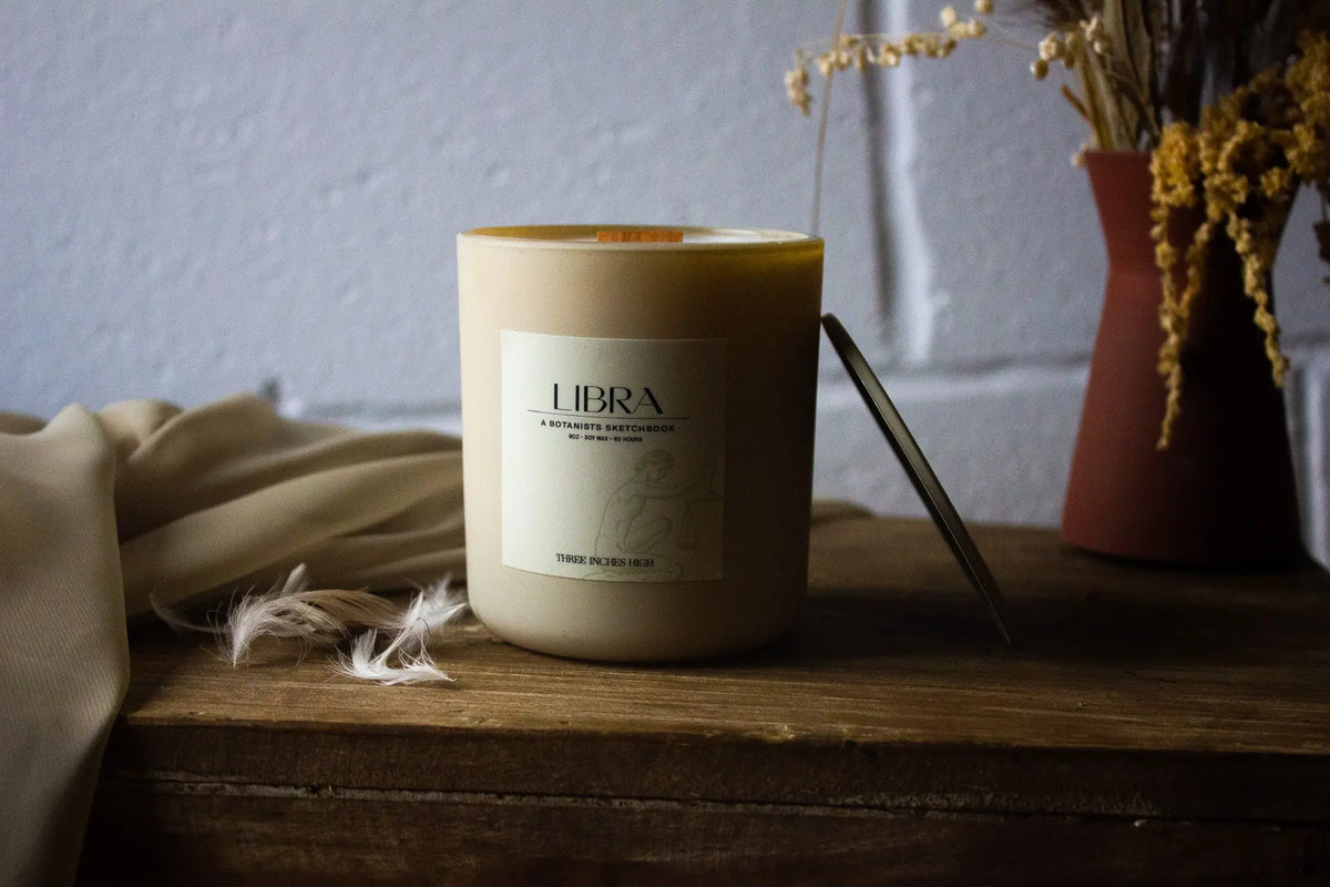 Libra soy wax candle by Three Inches High in an 8oz container, showcasing a sleek design ideal for aromatherapy and relaxation.
