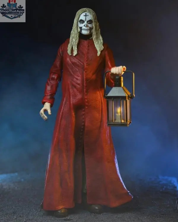 Toy Snowman Otis action figure in red robe, 20th anniversary collectible from House of 1000 Corpses, detailed toy collectible.
