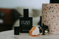 Three Inches High Prairie Smoke Eau de Parfum bottle with smoky, earthy fragrance, elegant design, and sophisticated branding.