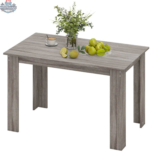Light grey Spencer 47-inch dining table by SLOTH Nation, ideal for 4 to 6 people, in a modern kitchen setting