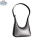 Origyn 01 vegan leather handbag with shoulder strap, made from sustainable MIRUM® plastic-free material, in earthy tones.