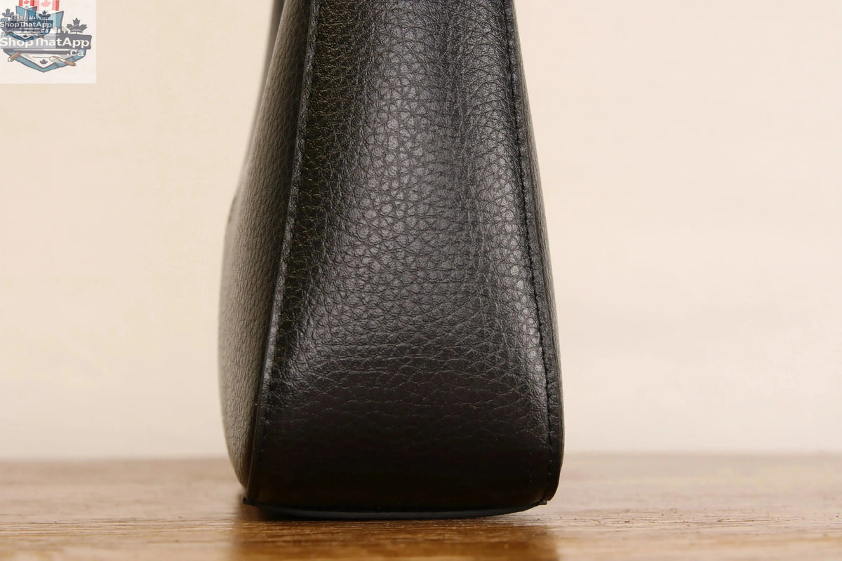 Origyn 01 vegan leather handbag made from plastic-free MIRUM® material, featuring a stylish shoulder bag design with sustainable craftsmanship.
