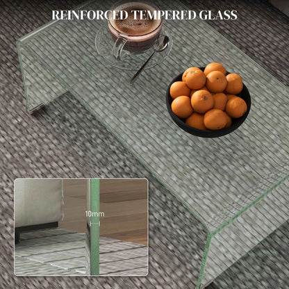 Modern glass coffee table by SLOTH Nation with rounded edges, featuring a sleek design and transparent tabletop for contemporary living rooms.