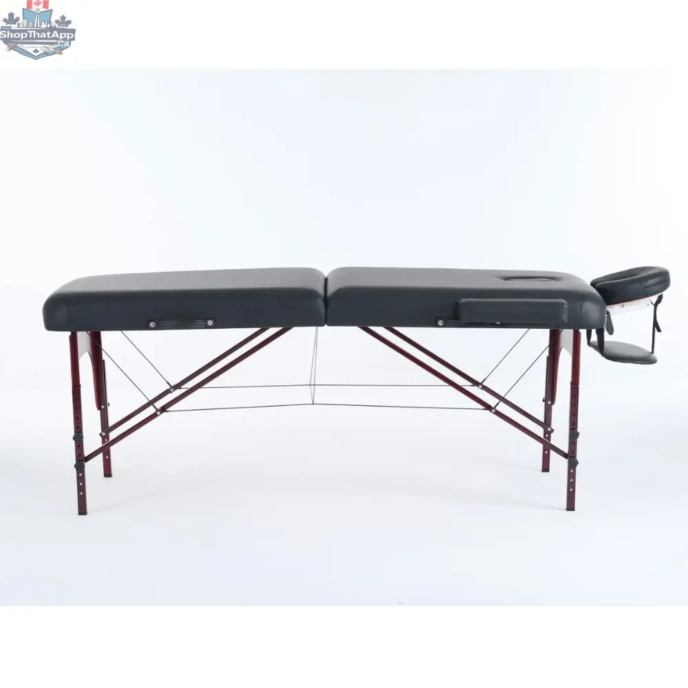 Greenlife Calgary 4-inch thick 2-section wooden portable massage table in black and cream, designed for professional massage therapy.