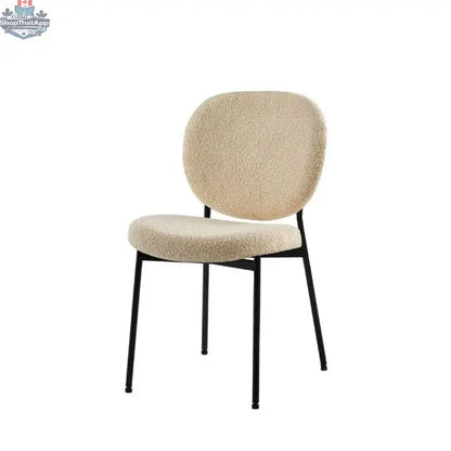 Hygge Design House Sashi Linen Boucle Dining Chair with curved wooden legs and plush fabric upholstery.