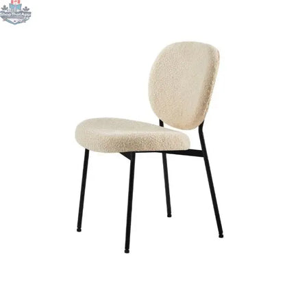 Hygge Design House Sashi Dining Chair with linen boucle upholstery, modern design, and wooden legs, shown from a front angle.