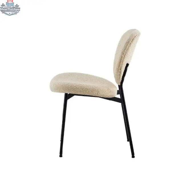 Hygge Design House Sashi Linen Boucle Dining Chair with modern upholstered design and wooden legs in a contemporary dining room setting.
