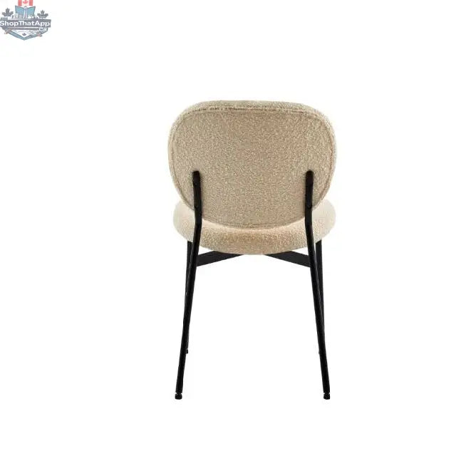 Hygge Design House Sashi Dining Chair in linen boucle with modern, upholstered design and wooden legs for contemporary dining rooms.
