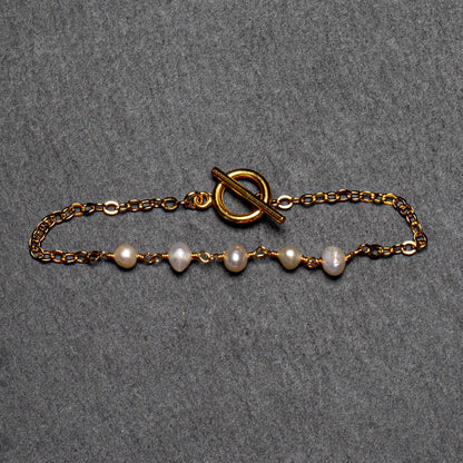 Gold plate pearl bracelet with chain design, showcasing elegant jewelry by Suzie Blue Canada