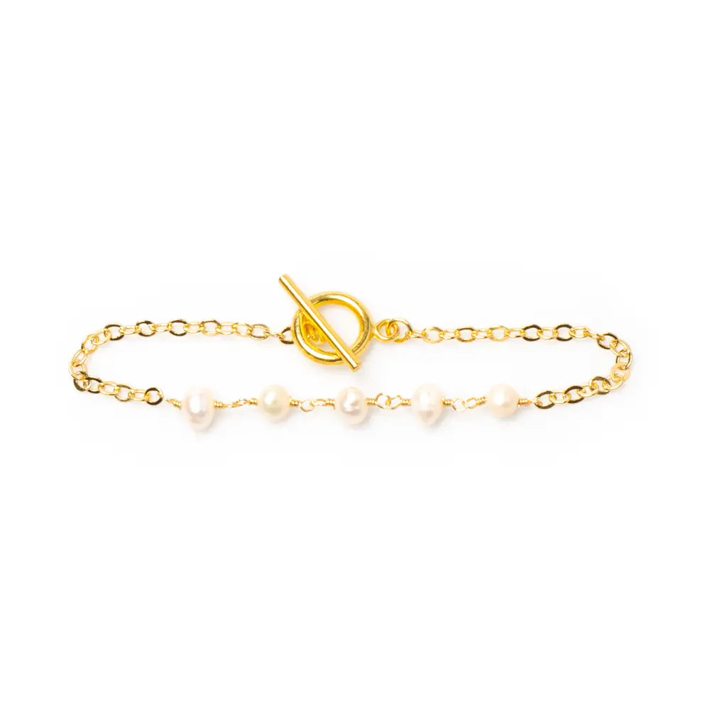 Delicate gold-plated pearl bracelet with chain design, featuring elegant pearls and intricate chain links, by Suzie Blue Canada.