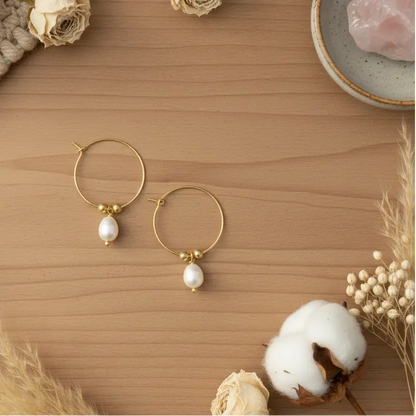 Gold plated hoop pearl earrings from Suzie Blue Canada featuring elegant design and classic pearl accents.