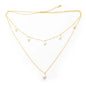 Double strand pearl necklace with gold plated chain from Suzie Blue Canada, featuring lustrous pearls and elegant design.