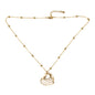 Gold plated stacked heart necklace by Suzie Blue Canada, featuring layered heart pendants on a delicate chain.