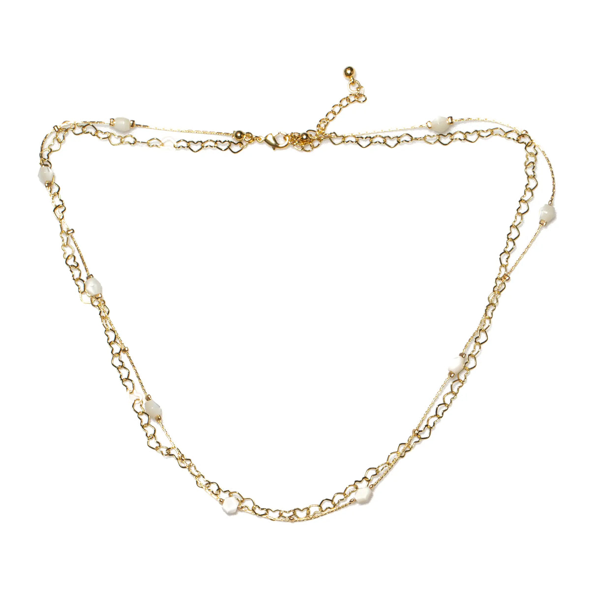Gold heart chain necklace with white beads, plated in gold, by Suzie Blue Canada, featuring a delicate and stylish design.