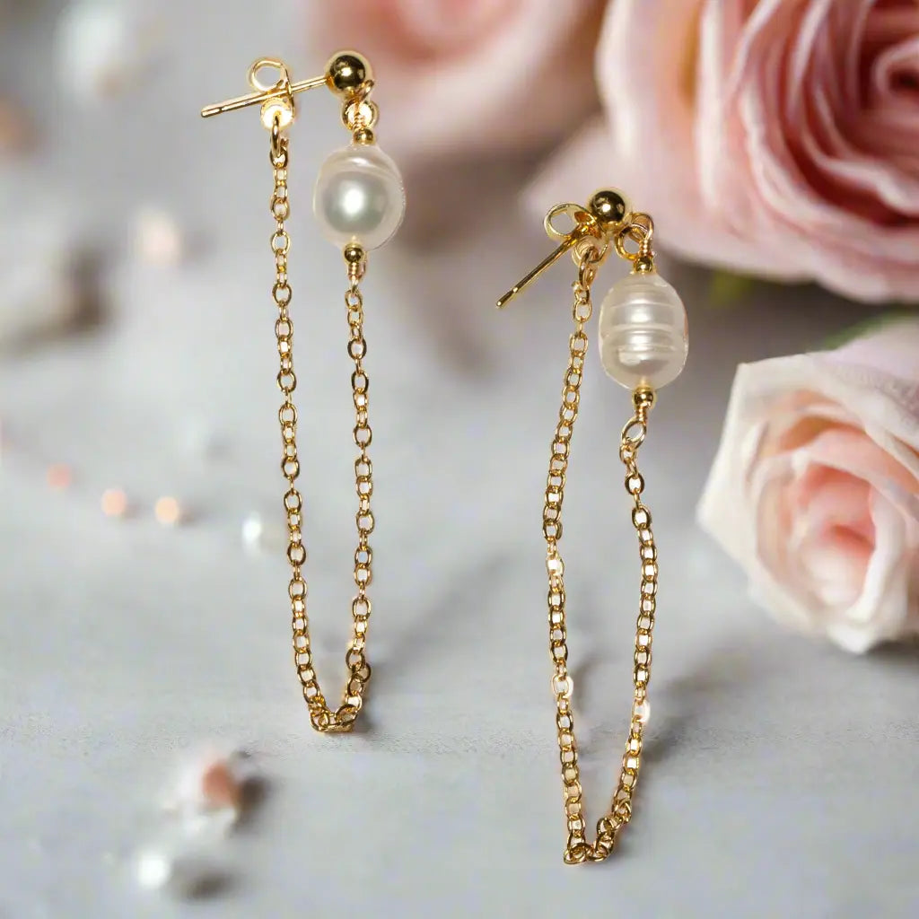 Gold-plated pearl chain stud earrings by Suzie Blue Canada featuring elegant, round pearl accents on classic earring posts.