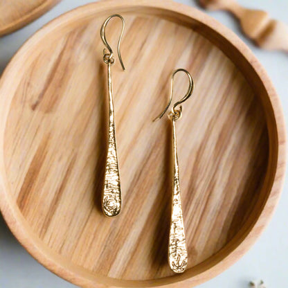 Gold-plated teardrop earrings by Suzie Blue Canada, elegant drop earrings with a sleek, polished finish in gold tone.