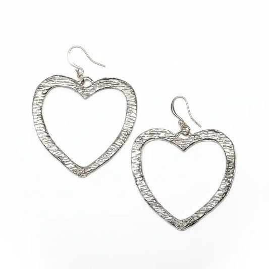 Silver plated textured heart earrings by Suzie Blue Canada, featuring a detailed heart design and shiny finish.