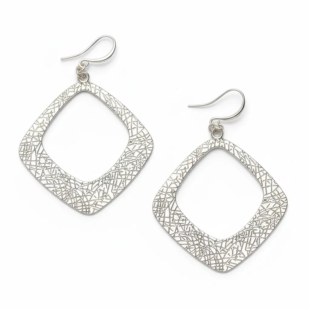 Silver plated textured diamond-shaped earrings from Suzie Blue Canada, featuring a modern geometric design.