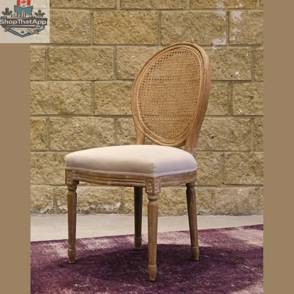Hygge Design House Napoleon dining chair with cane back and antique linen upholstery, showcasing elegant craftsmanship and classic style.
