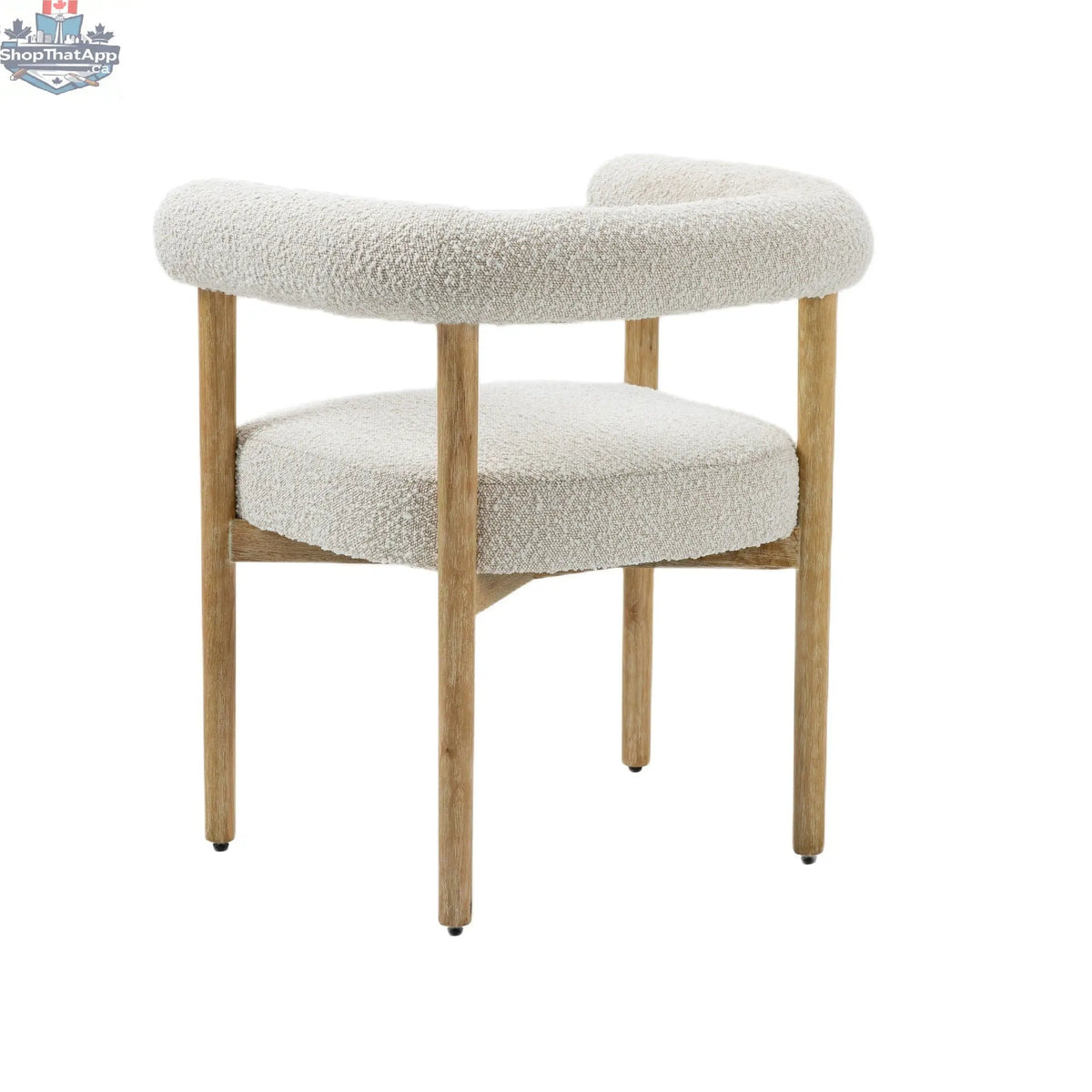 Cream Svea Boucle Dining Chair by Hygge Design House featuring plush boucle upholstery and modern wooden legs.
